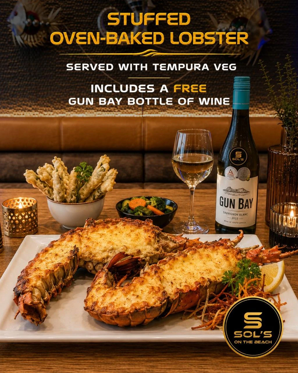 Stuffed oven-baked lobster with tempura vegetables and Gun Bay wine at Sol's On The Beach in Strand
